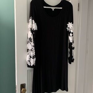 Great dress!!  Sleeves are beautiful cutout floral design!!